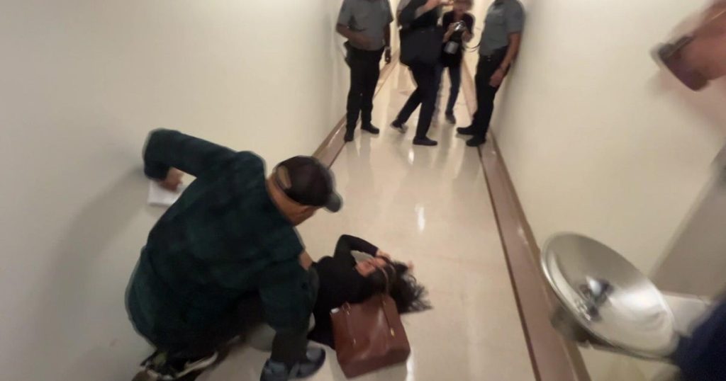 ICE officer seen on video pushing woman to ground has returned to duty